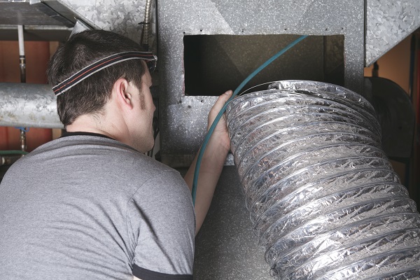 technician cleaning air ducts technician cleaning air ducts